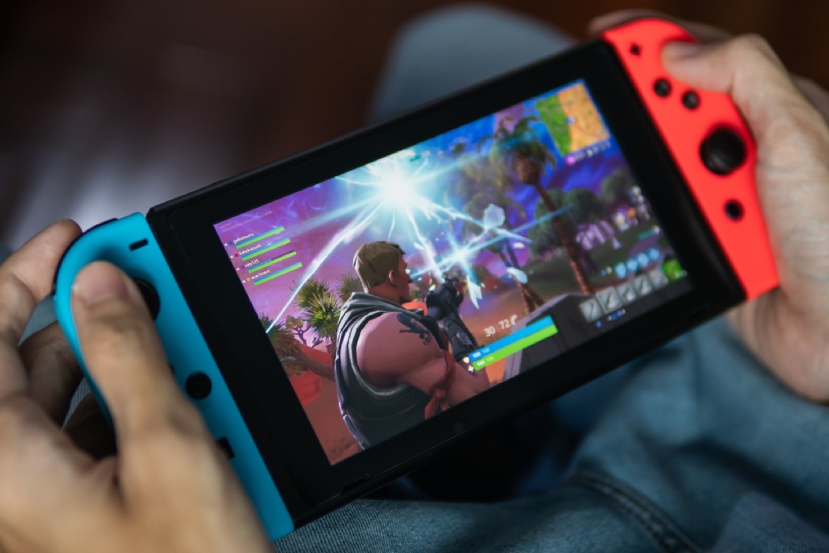 close up of person playing a game on nintendo switch