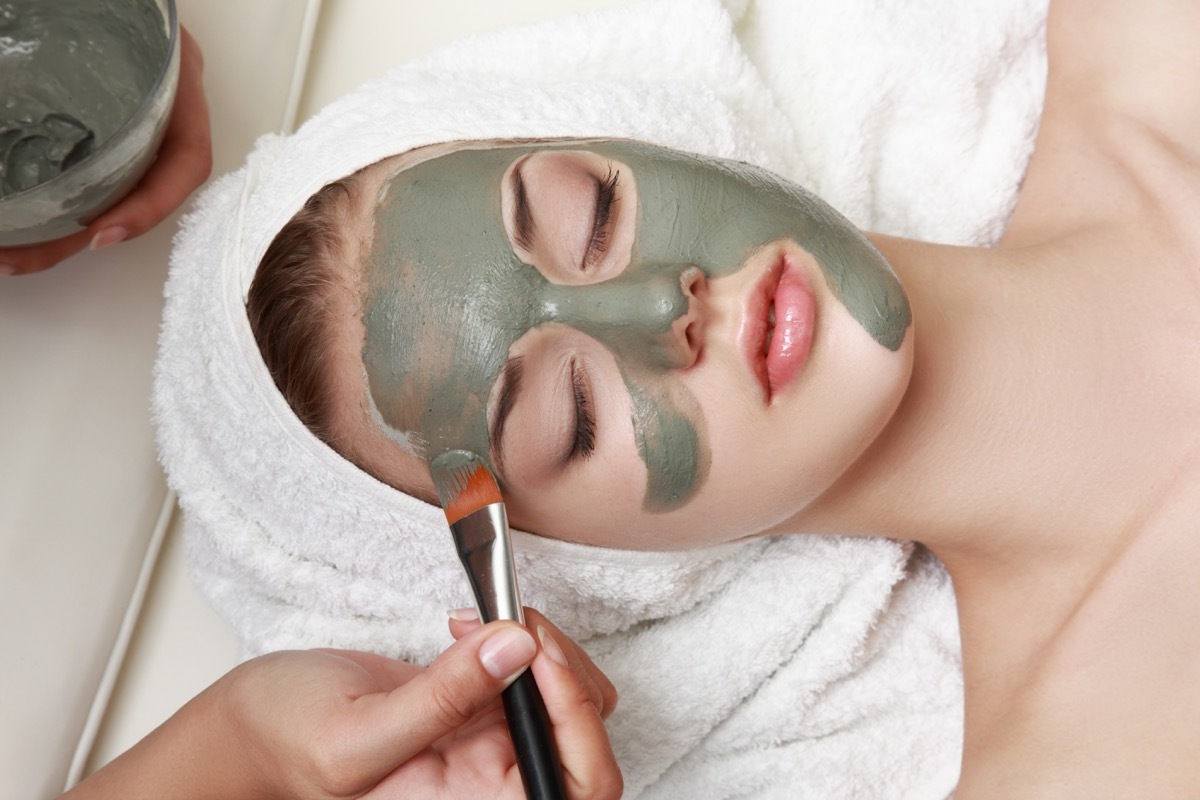 Woman getting a green facial
