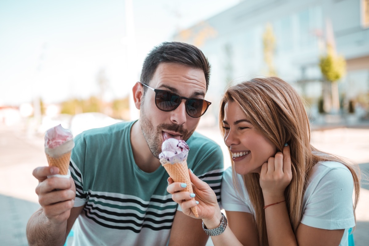 Young couple sharing ice cream