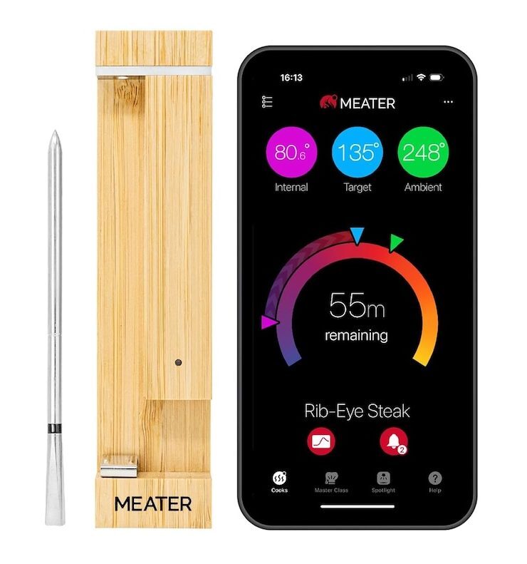 A Meater 2 Plus thermometer next to a smartphone with the app