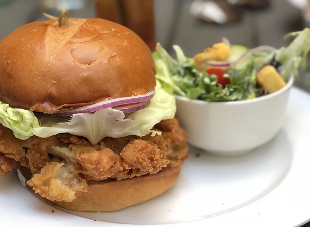 fried chicken sandwich with side salad