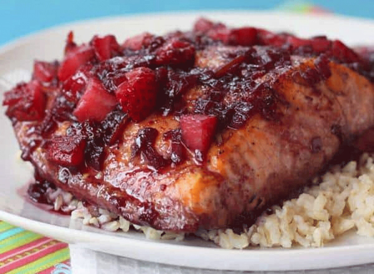 strawberry red wine glazed salmon on a plate of rice
