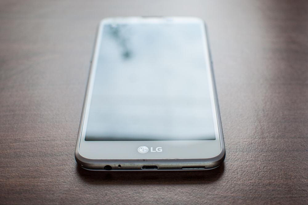 An LG mobile phone resting on a tabletop
