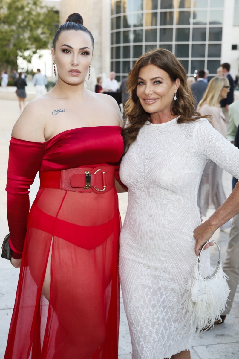 Arissa and Kelly LeBrock in red dress white dress