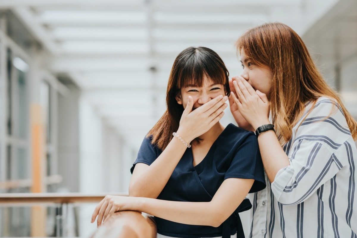Young Asian women laughing at a joke