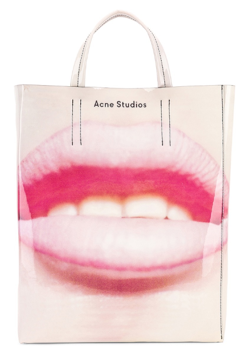 large tote with graphic design of lips on the front, luxury beach bags