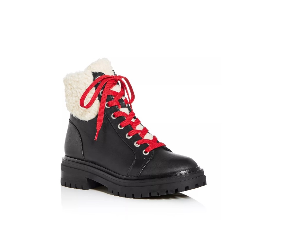 black combat boots with shearling cuff and red laces