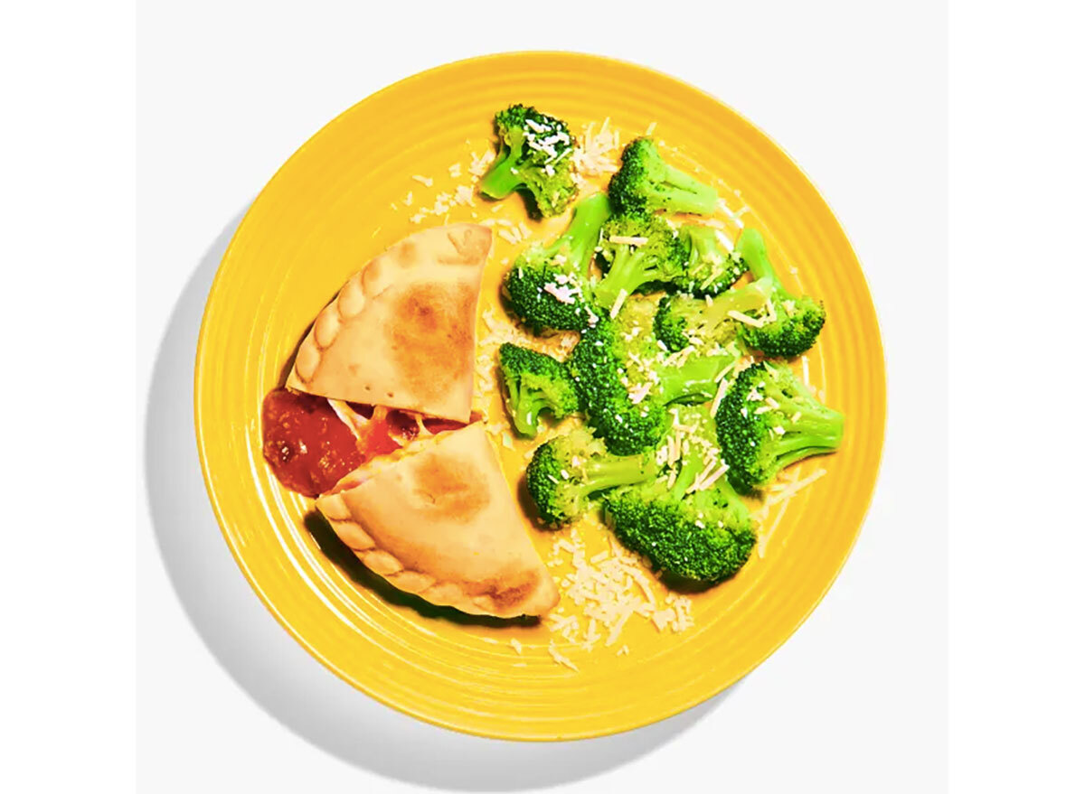 yumble kids meal pizza pocket broccoli on yellow plate