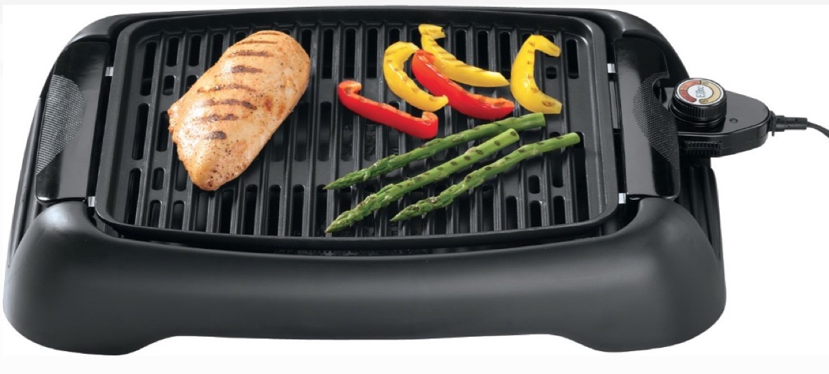 vegetables and chicken on black electric grill