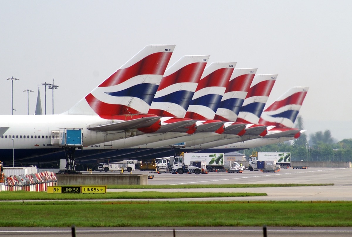 Fleet of Boeings 747 of British Airways standing on the apron of London Heathrow airport.