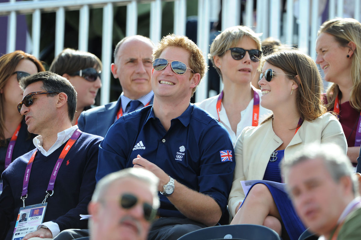Prince Harry and Princess Eugenie as they watch the Cross Country Phase of The Eventing at Greenwich Park, on the third day of the London 2012 Olympics.