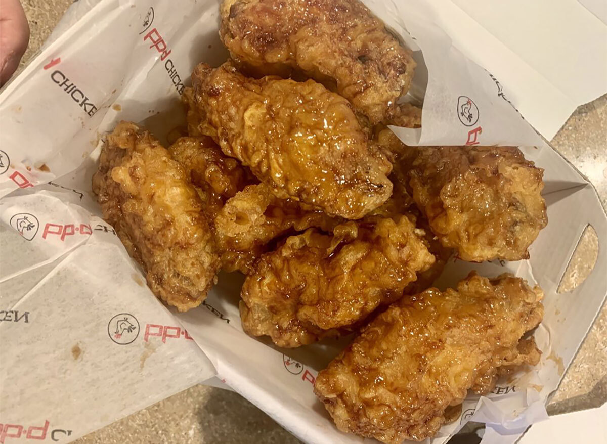 korean fried chicken wings with sauce in basket