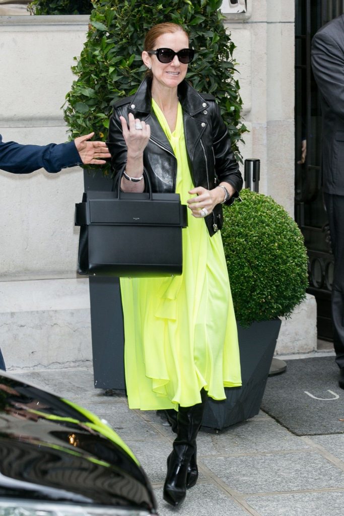 leather boots with a leather jacket and neon yellow tunic Celine Dion | 10 Reasons Why Celine Dion Is Our New Style Icon | Her Beauty