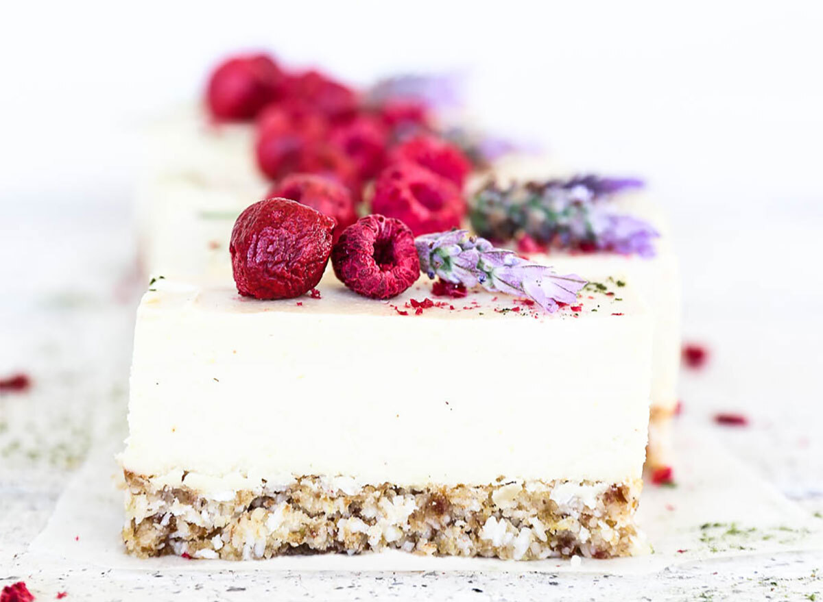 lemon coconut cheesecake topped with raspberries