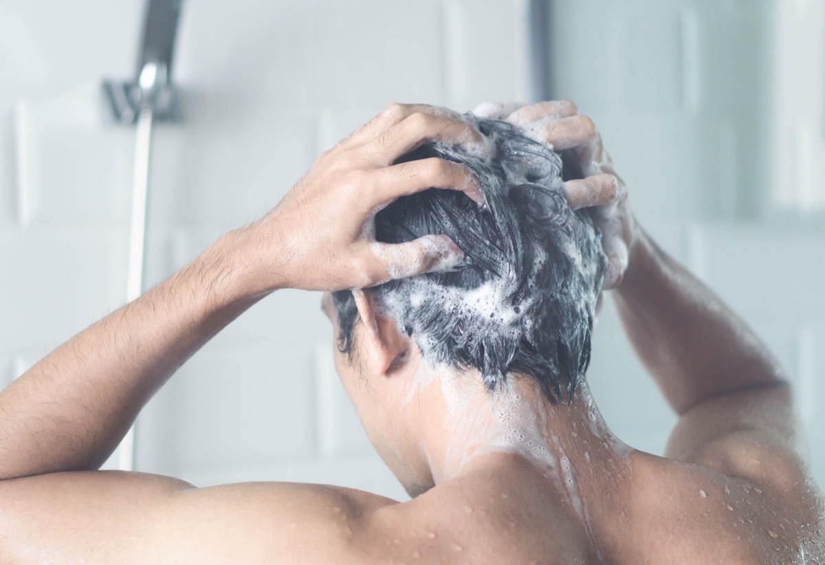 Man shampooing in shower