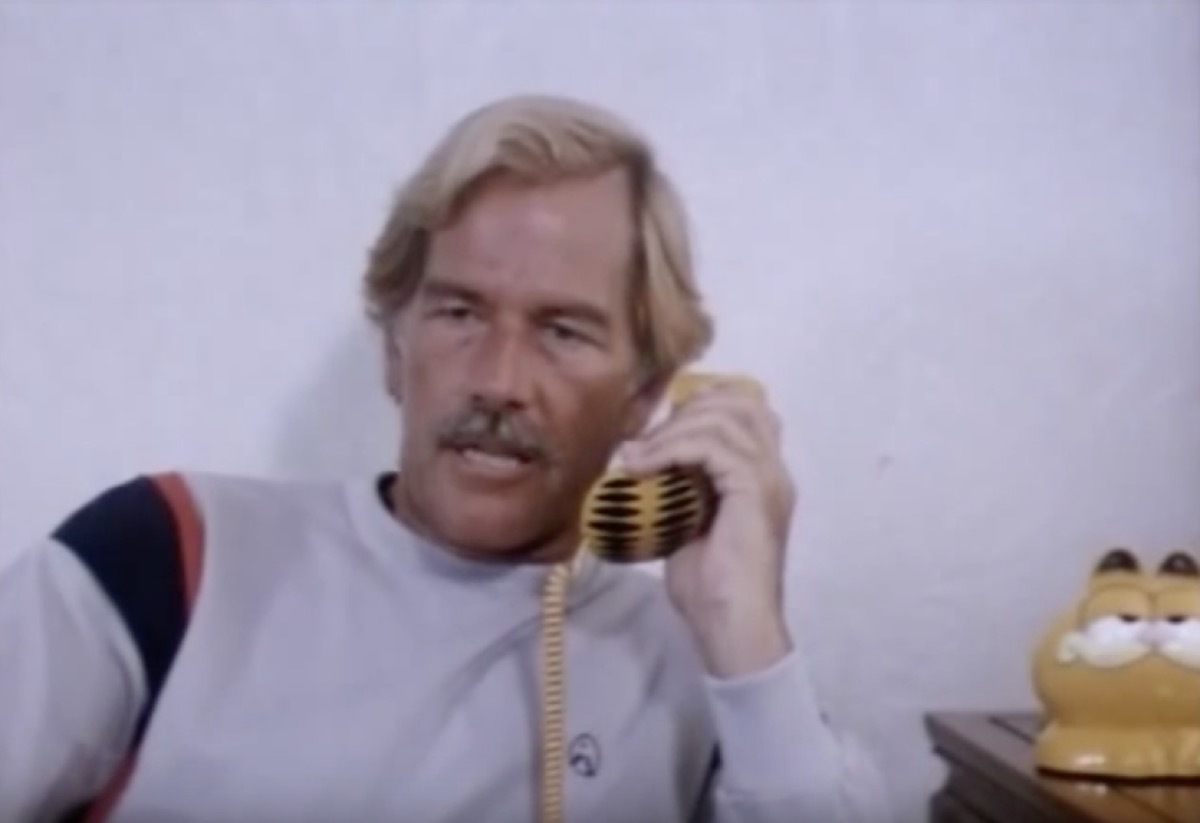 movie scene from ninja terminator, garfield phone, 1980s nostalgia