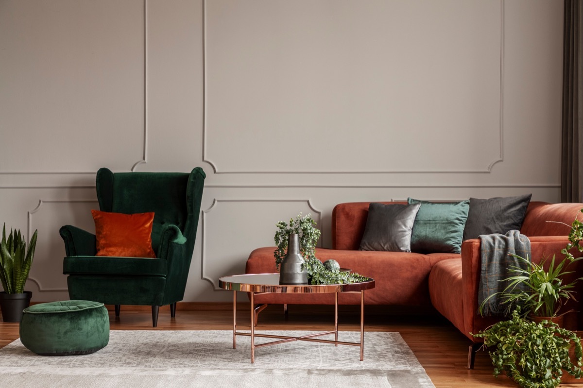 A green and orange living room space vintage home trends