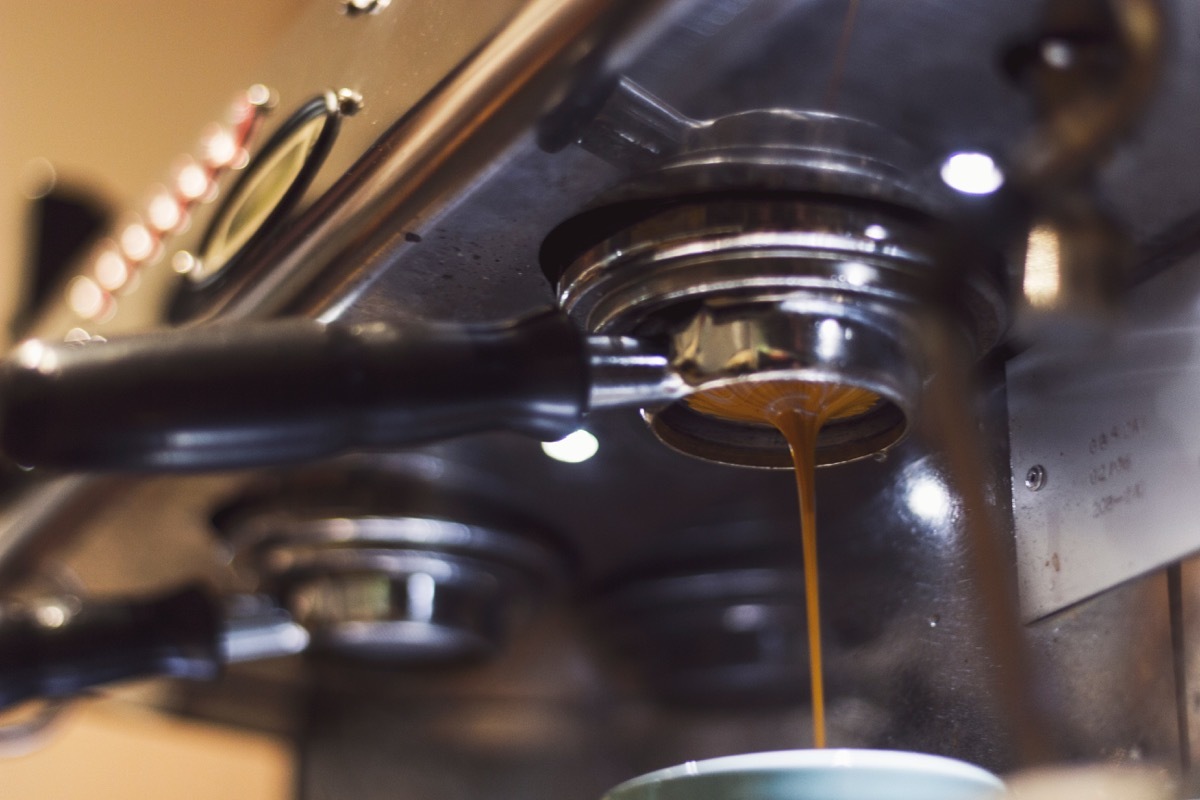 espresso machine drips espresso into cup