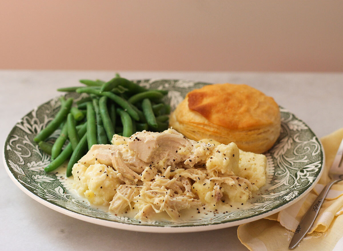 Copycat Cracker Barrel Chicken and Dumplings with a biscuit and green beans