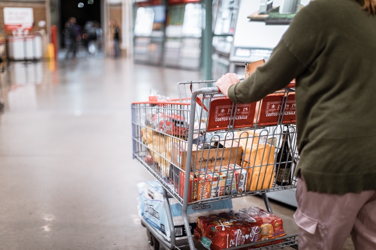 Tigard, Oregon - Nov 8, 2019 : People with carts in Costco Wholesale. Costco is an American multinational corporation which operates a chain of membership only