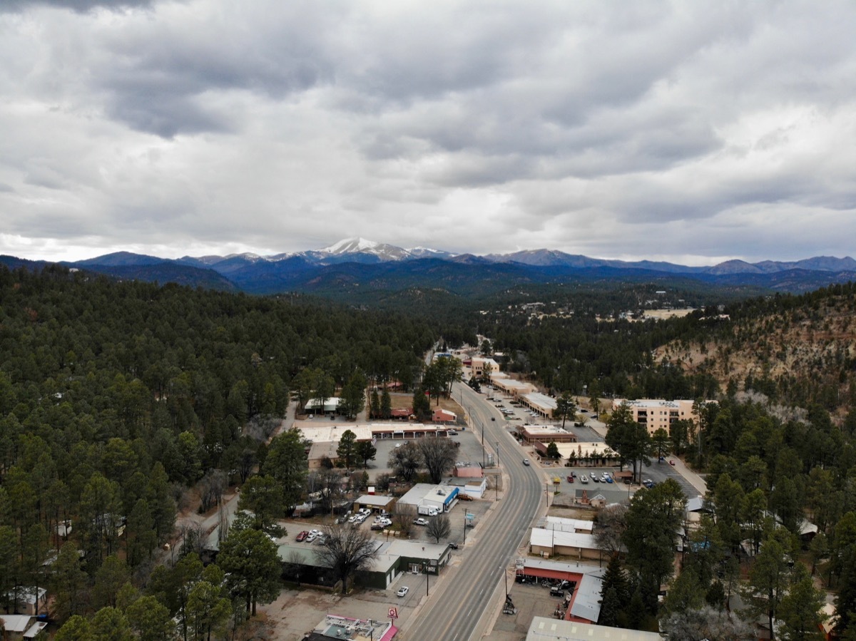 Tiny village of Ruidoso surrounded by snowy mountains. 