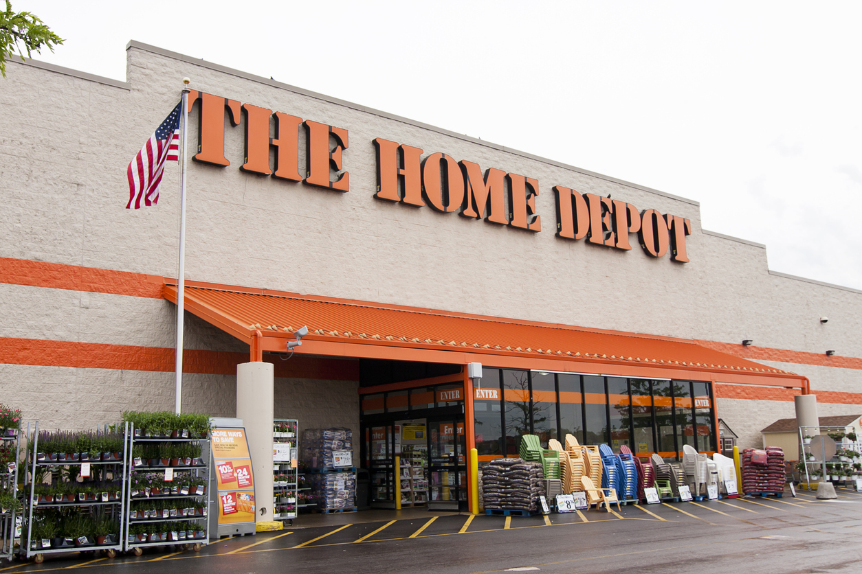 A home depot storefront with chairs and other items for sale
