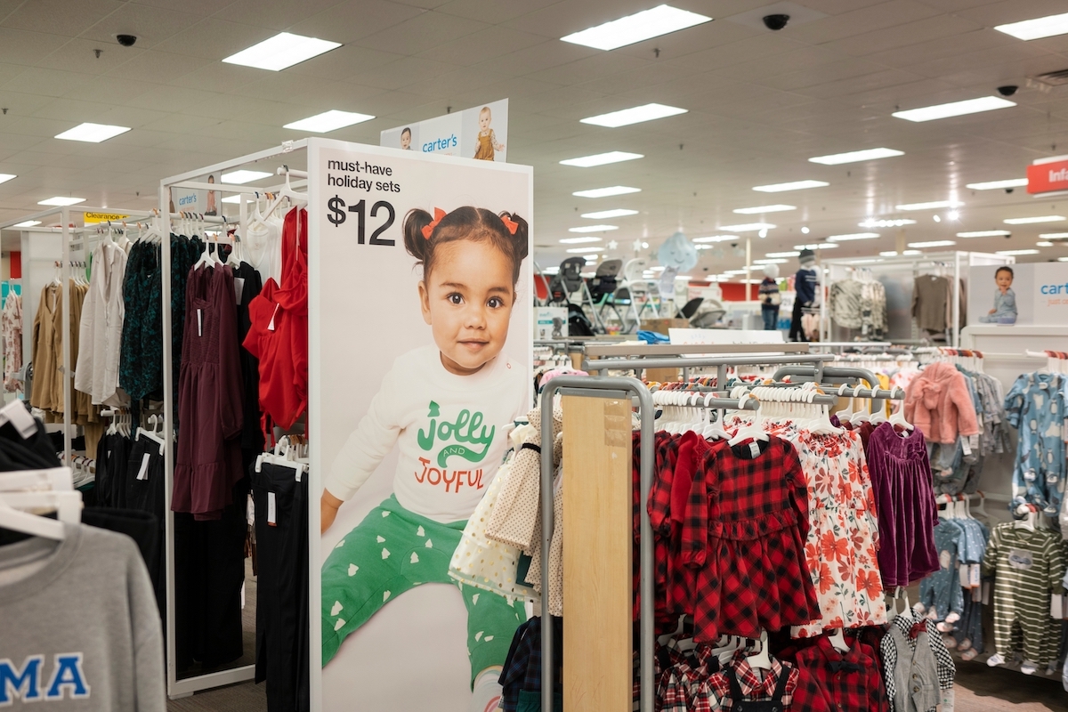 Display of kids' clothing and Carter's baby clothes at a Target store
