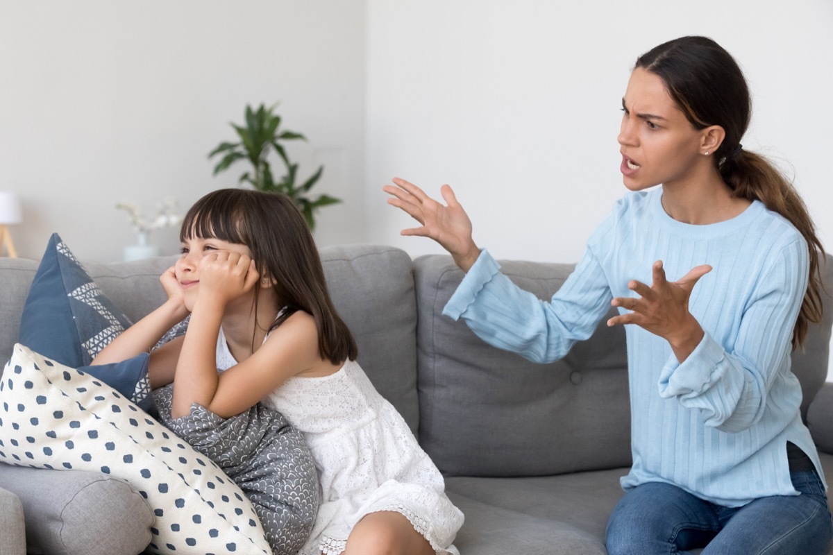 mom shouting at daughter on couch