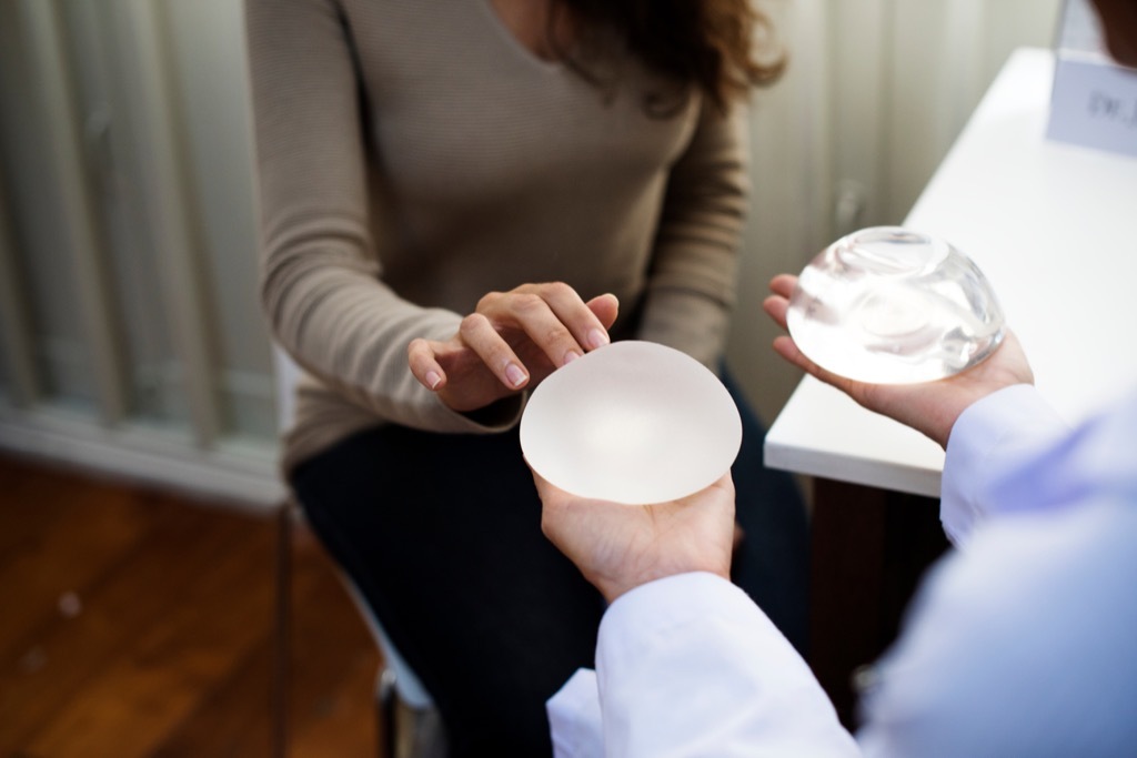 woman consulting with a plastic surgeon about breast implants
