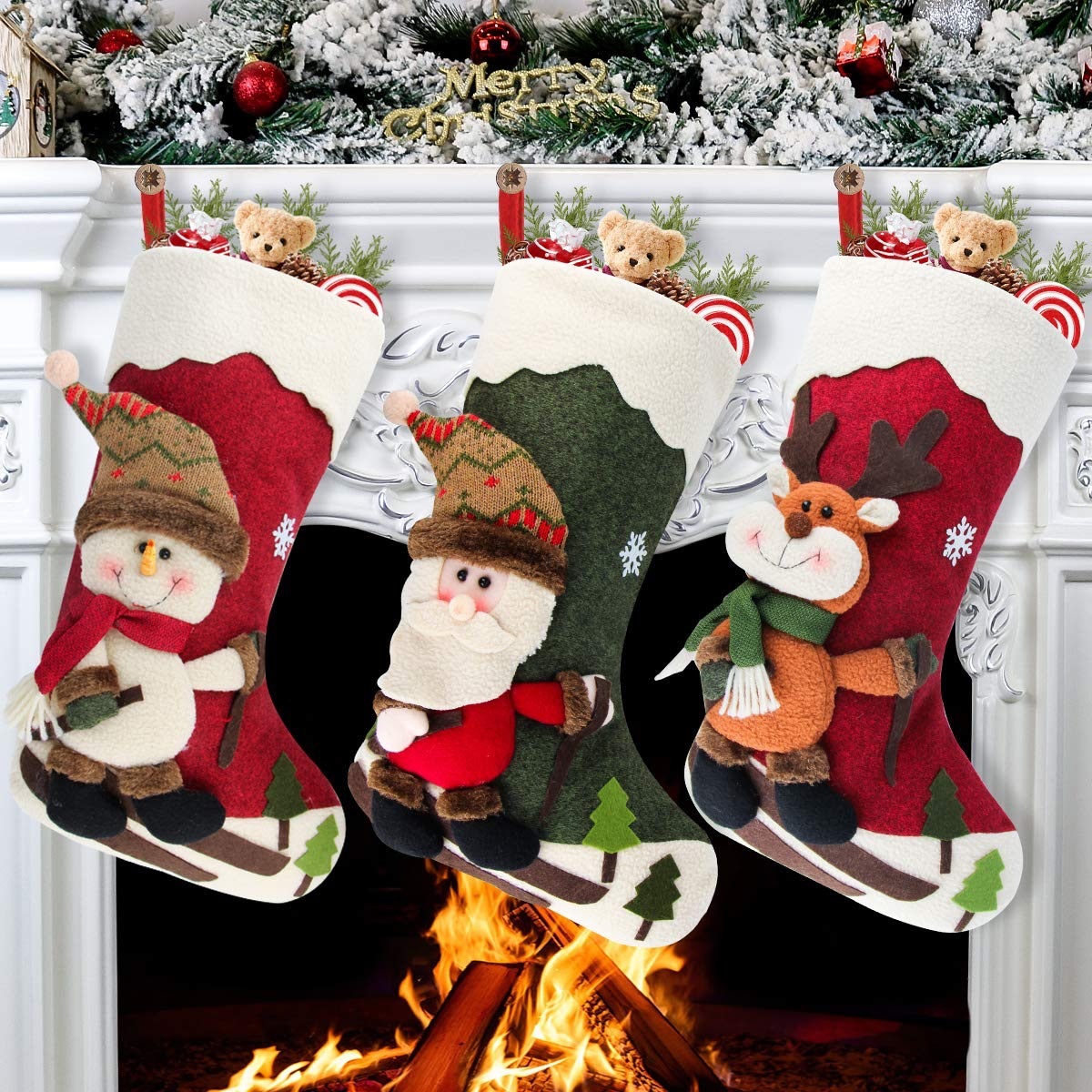 three stockings with 3d winter characters hung on mantle