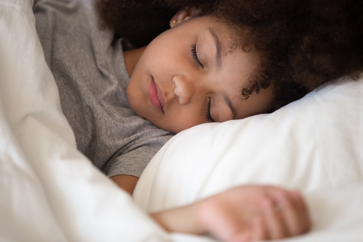 young black girl sleeping in bed