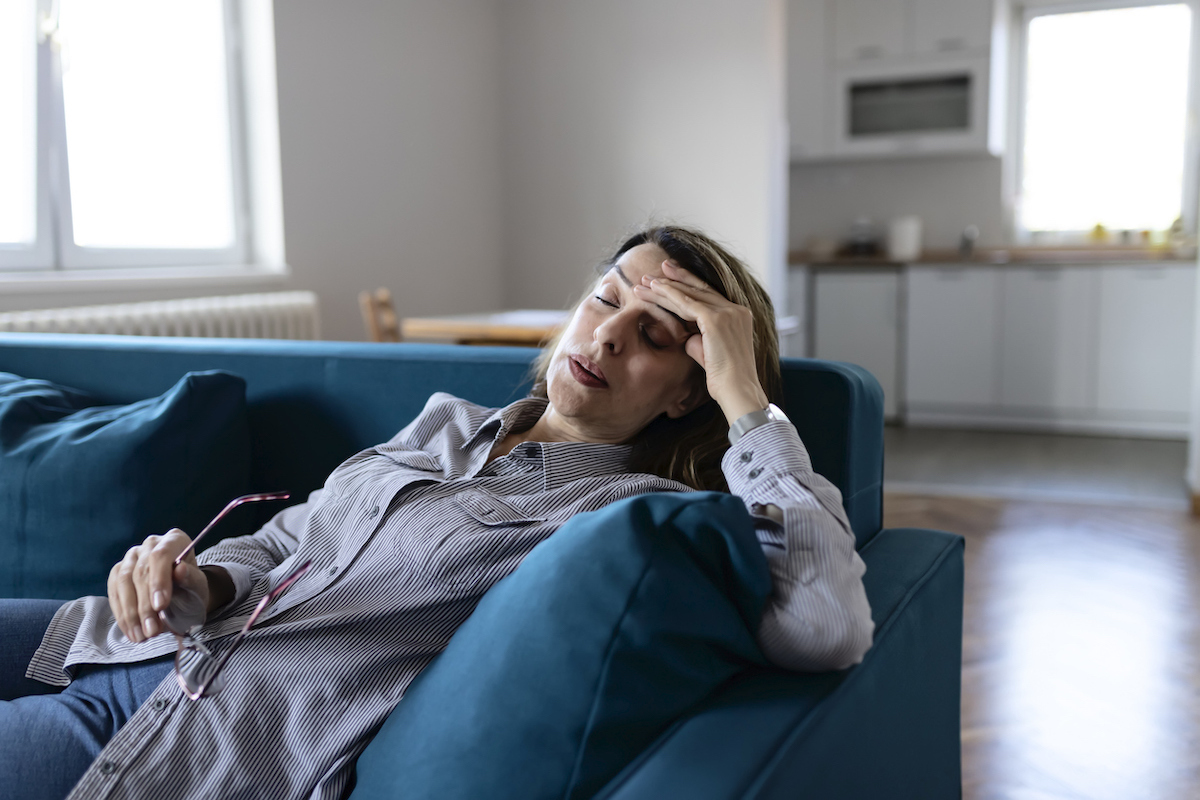 Woman at Home Suffering From Headache