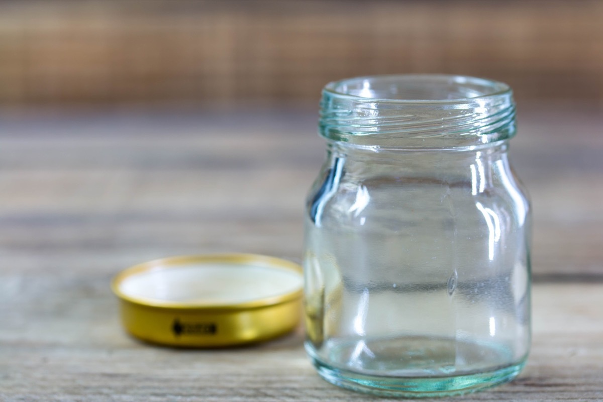 open glass jar next to gold lid
