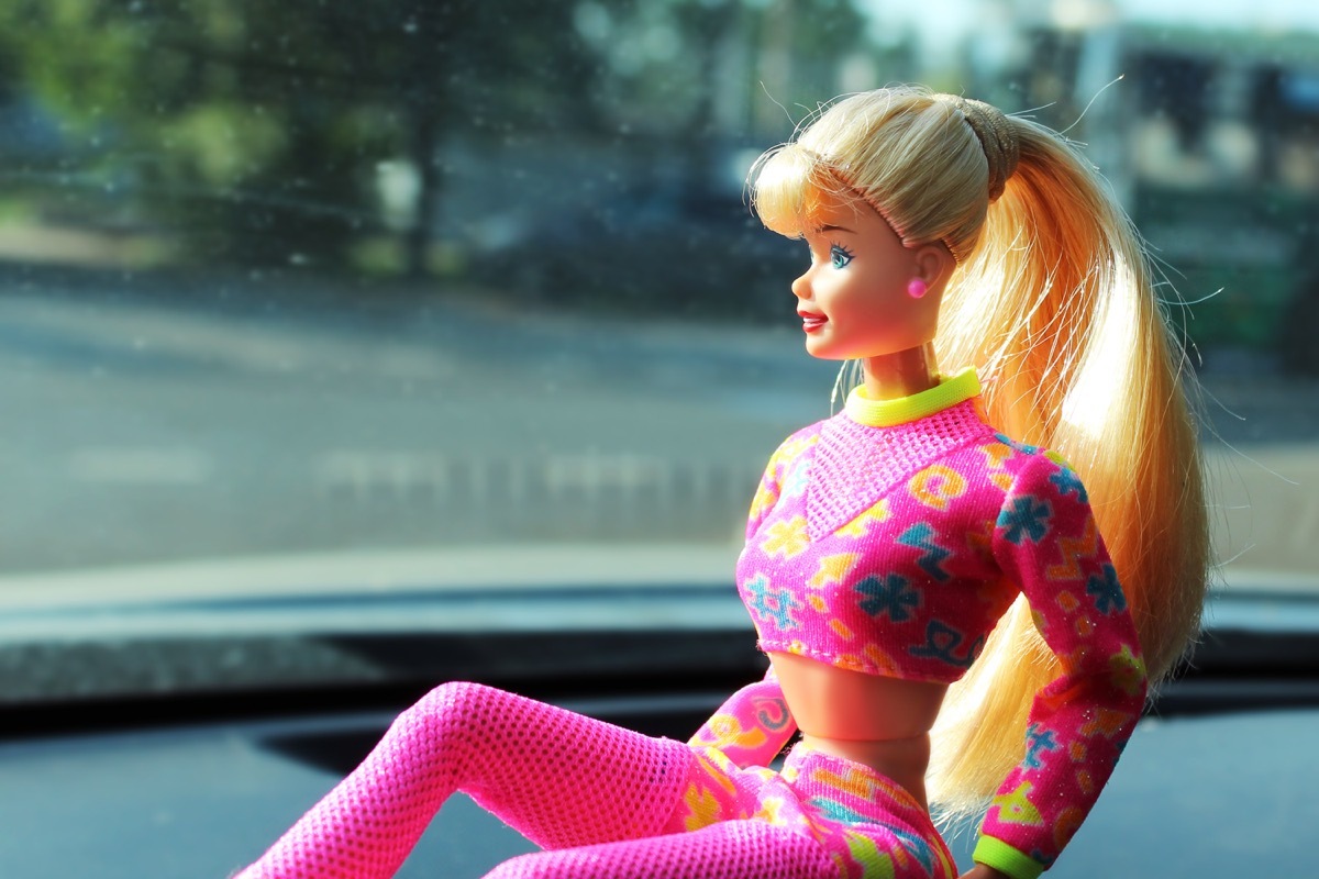 vintage barbie russian doll on a car dashboard