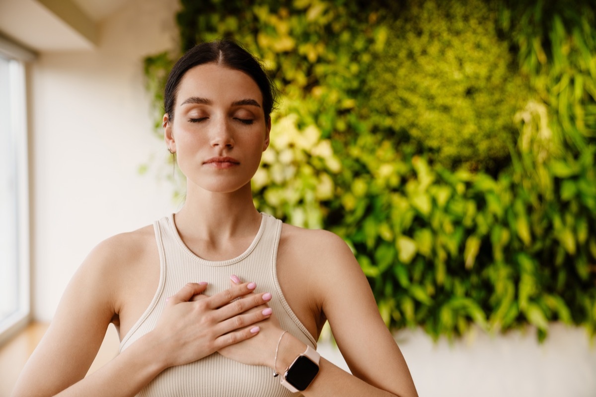 woman doing breathing exercises