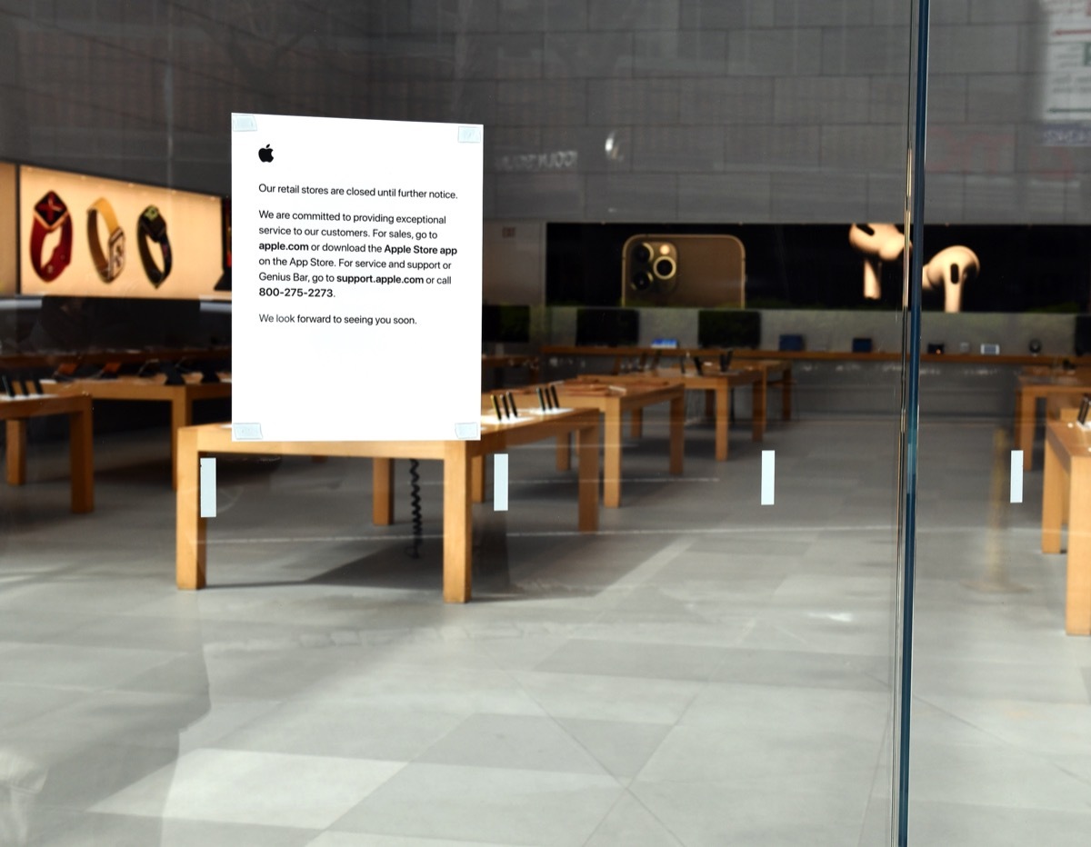 apple store with closed sign in window