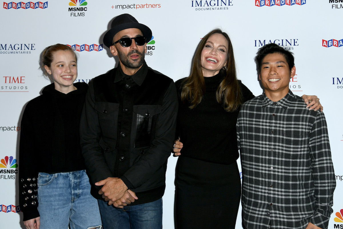 Shiloh Jolie-Pitt, artist JR, Angelina Jolie, and Pax Jolie-Pitt at the premiere of 