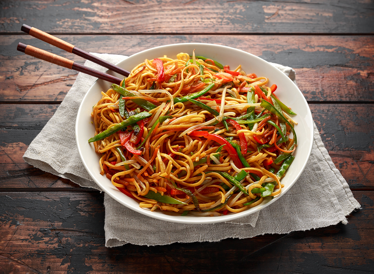 bowl of chow mein with chopsticks