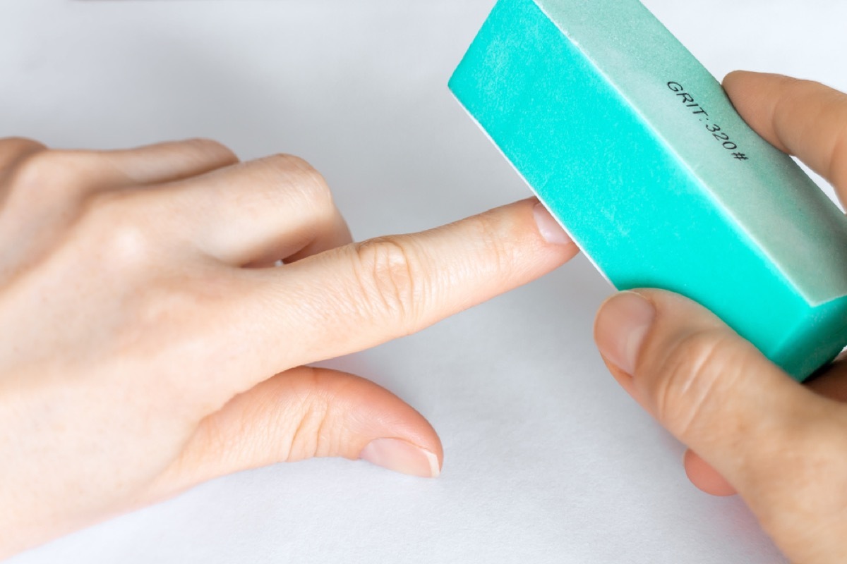 buffing nails with turquoise buffer