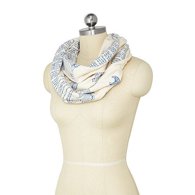headless mannequin wearing blue and white Maya Angelou scarf