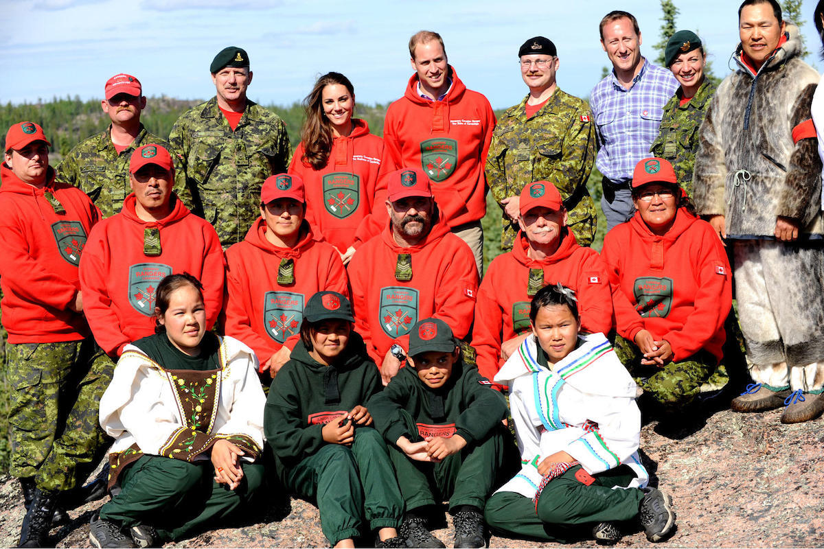 Prince William and his wife Kate, the Duke and Duchess of Cambridge (back centre) pose for a group photo with Canadian Rangers at Blachford Lake during their royal tour to Yellowknife, North West Territories, July 5, 2011