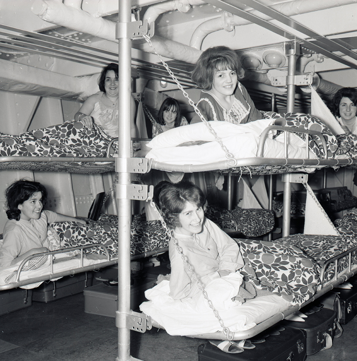 six women sleep on bunk bets in a vintage cruise ship