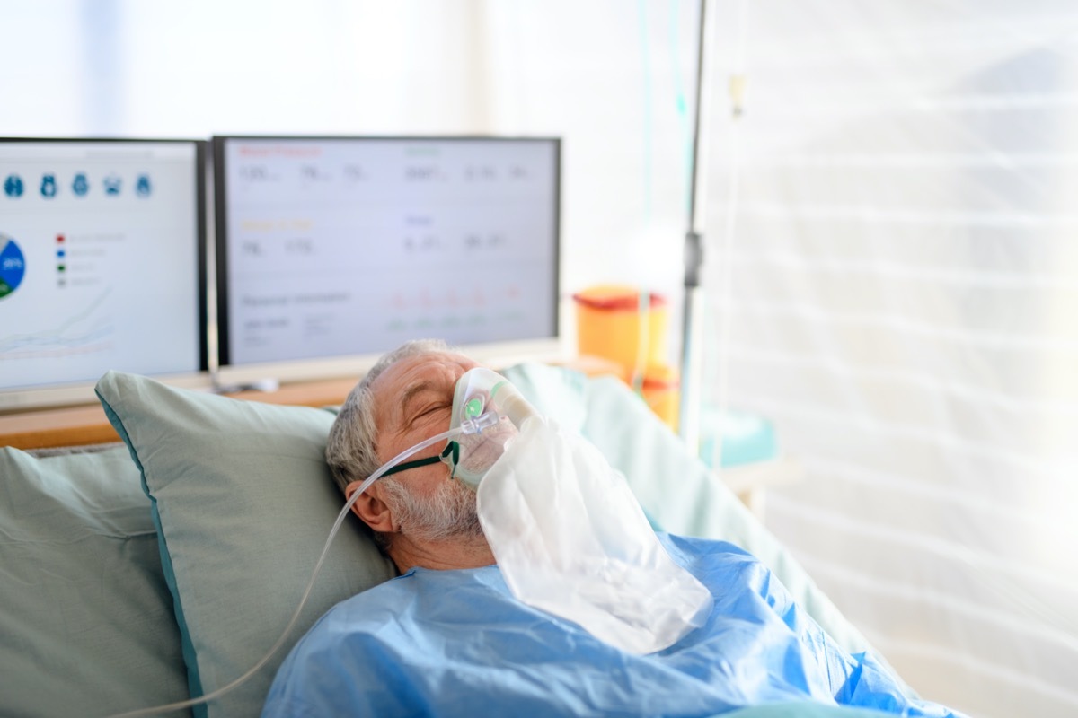 Infected patient in quarantine lying in bed in hospital, coronavirus concept.