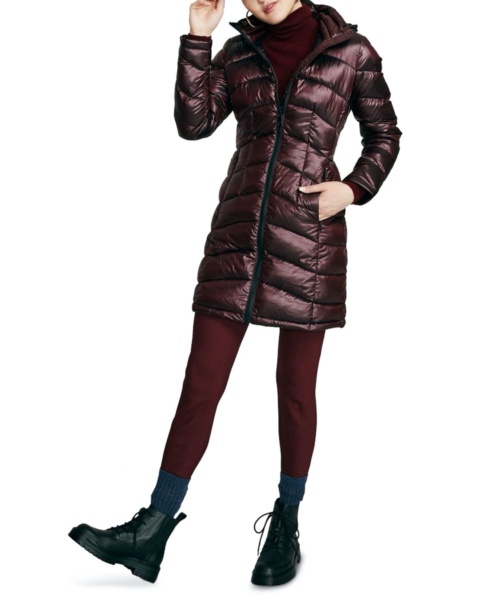 woman in hip-length purple or brown puffer coat