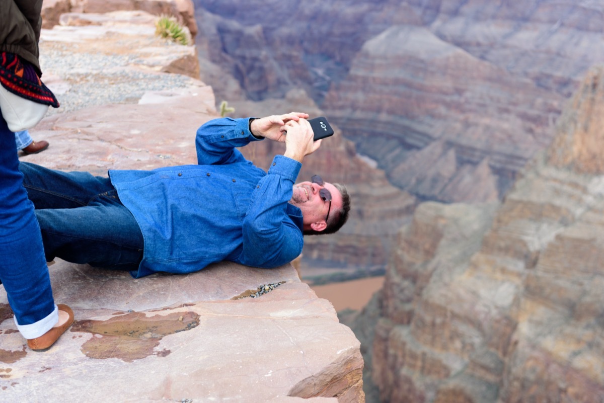 Tourist Taking pictures at Eagle Point and Skywalk at Grand Canyon West Rim