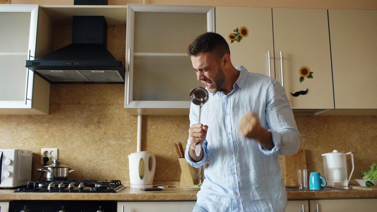 singing man in kitchen