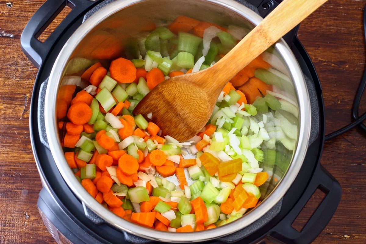 pressure cooker full of chopped vegetables