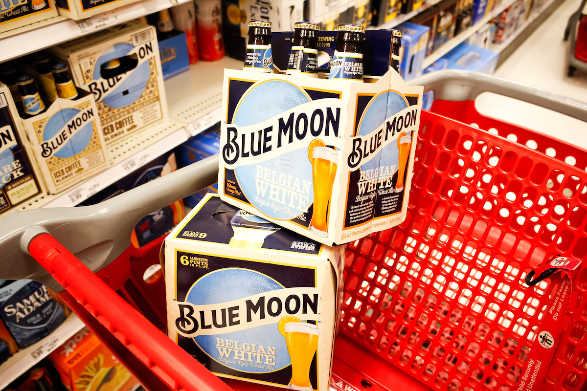 A view of several cases of Blue Moon beer stacks inside a shopping cart, in a local grocery store.