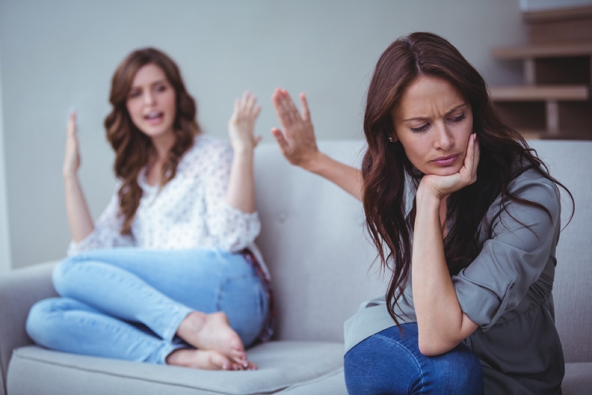 female friends or lesbian couple arguing on couch, things you should never say to your spouse