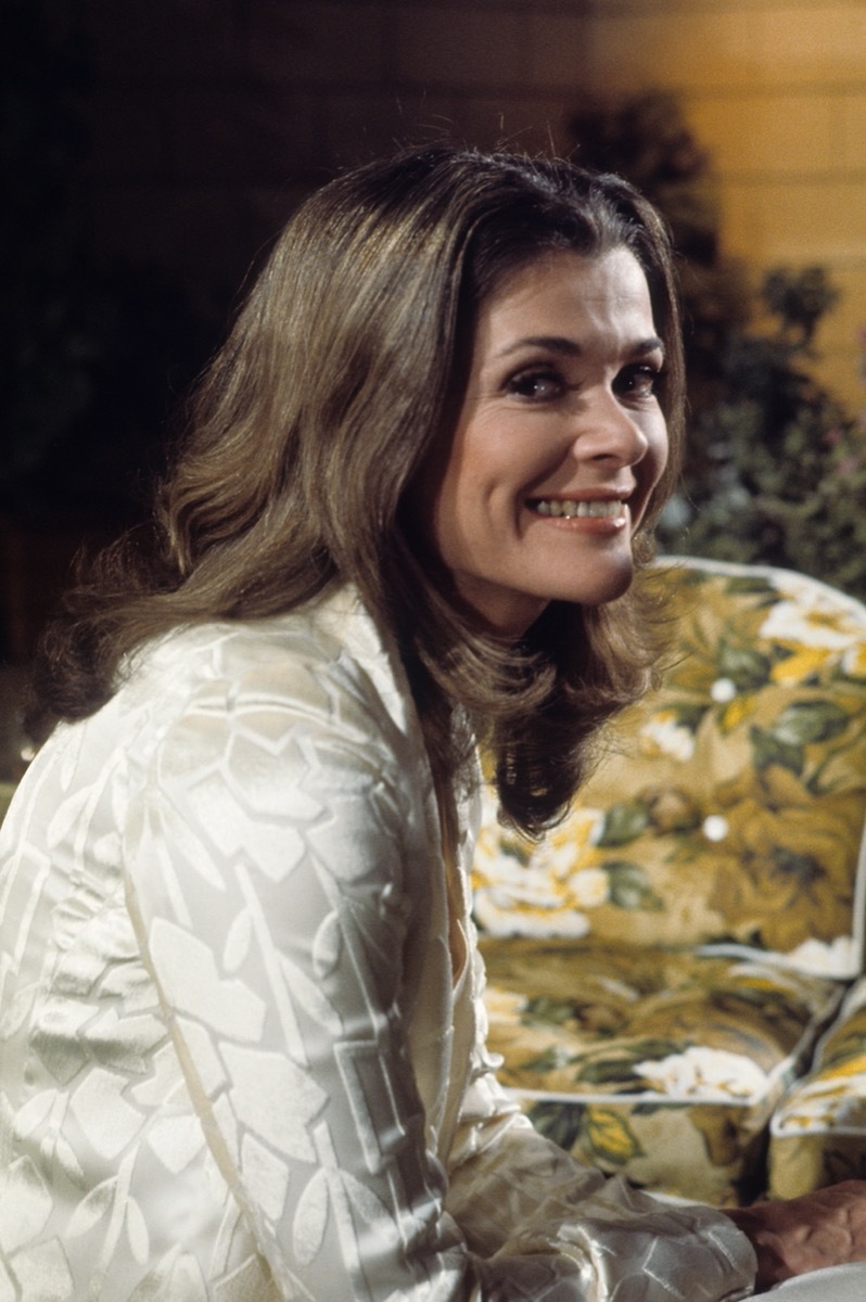 jessica walter in white top smiling at camera